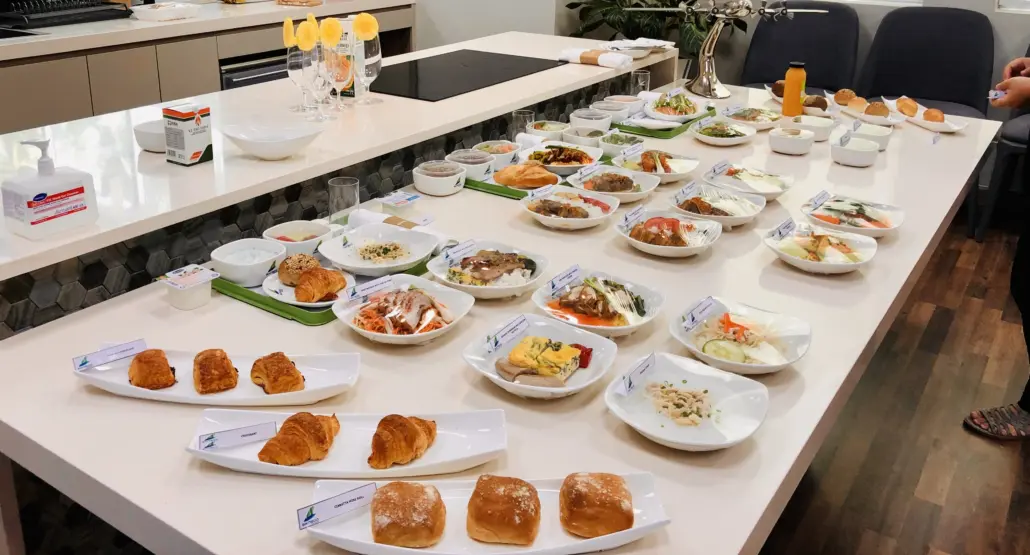 A table with many plates of food on it