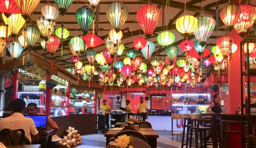 A room filled with colorful lights and hanging lanterns.