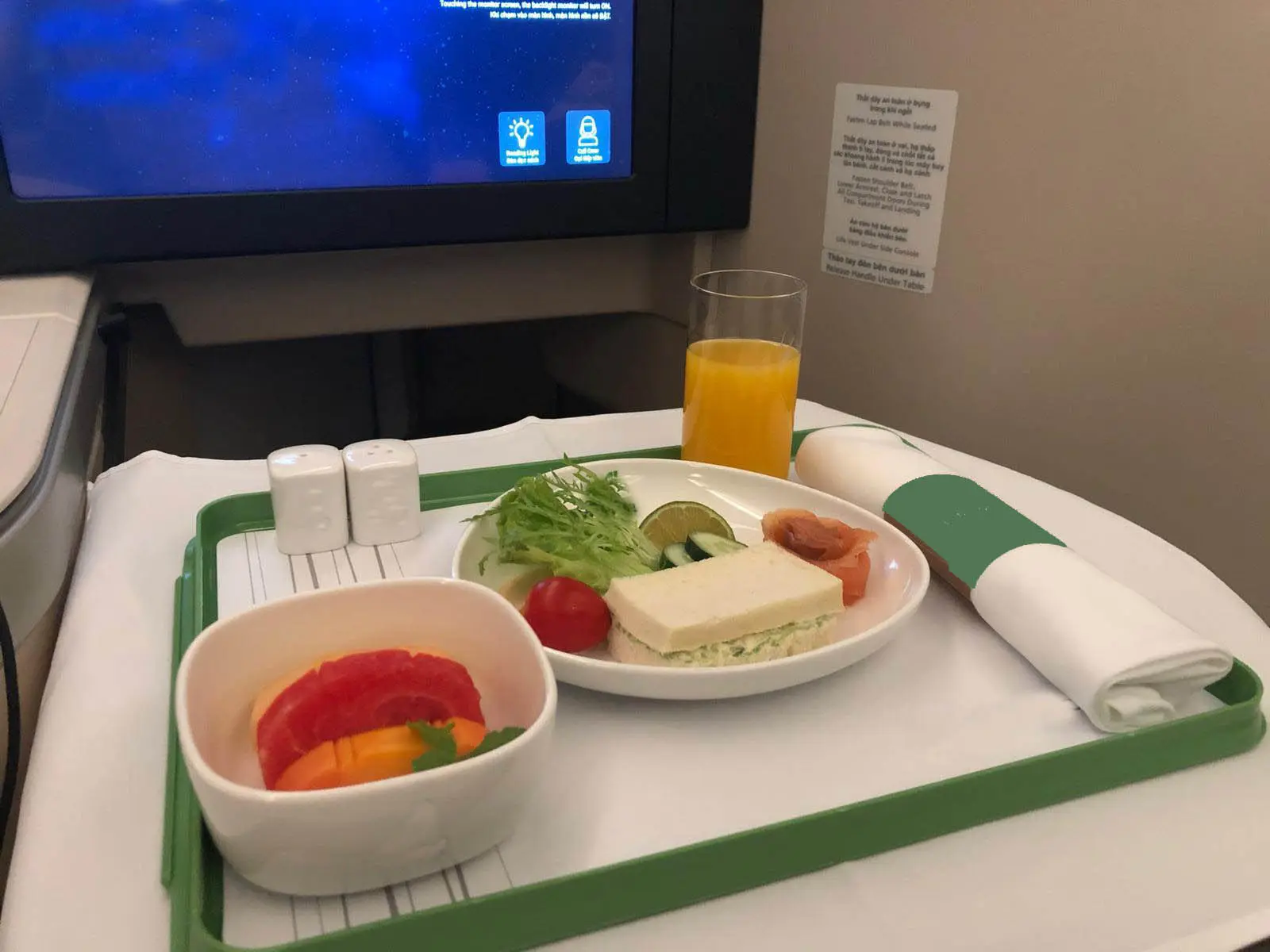 A tray with food and juice on it